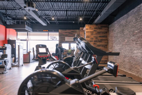 Well-equipped fitness center with treadmills, bikes, and gym machines for optimal workout routines.