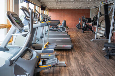 Stair climber and elliptical machines in cardio area at Apex Personal Fitness Youngstown NY