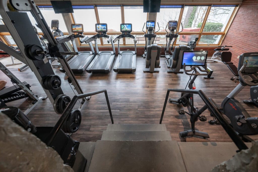 Treadmills and cardio machines on spacious gym floor at Apex Personal Fitness Youngstown NY