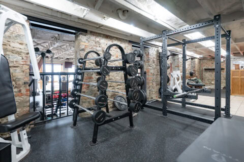 Squat rack and free weights at Apex Personal Fitness gym Youngstown NY