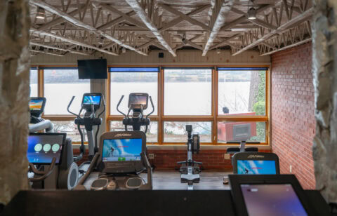 Modern workout space with strength training equipment and lockers, perfect for fitness and personal training.