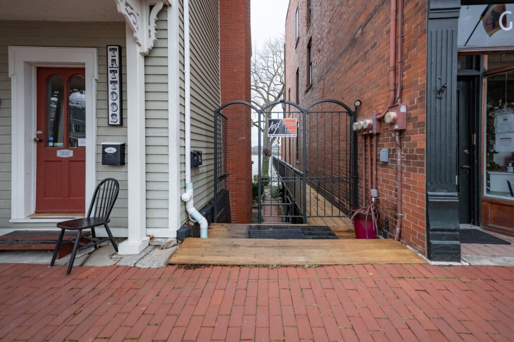 Outdoor view of Apex Personal Fitness entrance with brick walls and welcoming gate.